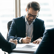 A group of bankers working at a table.