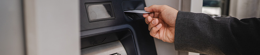 A man using an ATM.