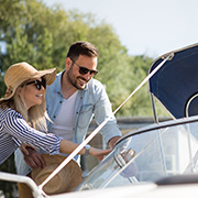 A happy couple looking at their new boat.