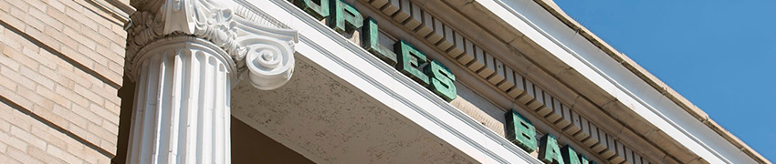 The entryway of The Peoples Bank building at an angle.